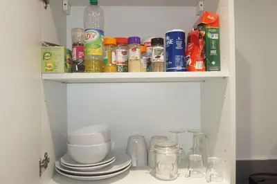 Cuisine ou kitchenette dans l'établissement Coquet STUDIO TOUT ÉQUIPÉ CENTRE VILLE WIFI 2PERS