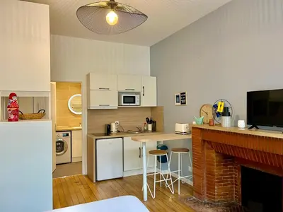 Cuisine ou kitchenette dans l'établissement Suite Clovis - 1