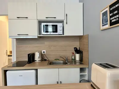 Cuisine ou kitchenette dans l'établissement Suite Clovis - 1