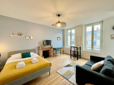 Coin salon dans l'établissement Suite Clovis 5