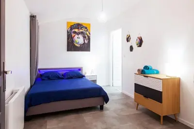 Un ou plusieurs lits dans un hébergement de l'établissement La Sweet House Dorée Centre Ville Wifi Tout confort