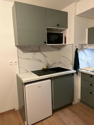 Cuisine ou kitchenette dans l'établissement Appart 500 m centre ville - gare