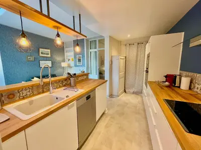 Cuisine ou kitchenette dans l'établissement Le Jardin Des Sacres - HyperCentre Cathédrale