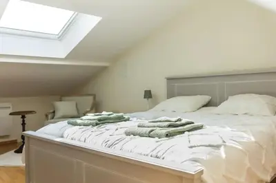 Un ou plusieurs lits dans un hébergement de l'établissement Maison 'Millésime' spacieuse et confortable