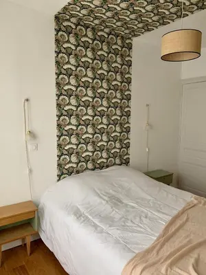 Un ou plusieurs lits dans un hébergement de l'établissement Champagne! Appartement spacieux Reims centre
