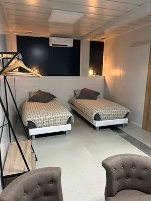 Un ou plusieurs lits dans un hébergement de l'établissement Les Chambres de Campagne