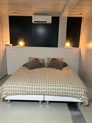 Un ou plusieurs lits dans un hébergement de l'établissement Les Chambres de Campagne