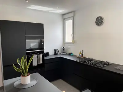 Cuisine ou kitchenette dans l'établissement Le cinquante-deux appartement de Charme