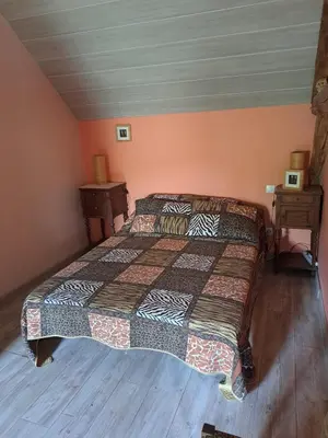 Un ou plusieurs lits dans un hébergement de l'établissement La Hulottière Chouette Gîte
