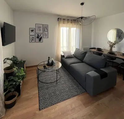 Coin salon dans l'établissement Appartement proche Disneyland