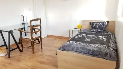 Un ou plusieurs lits dans un hébergement de l'établissement Le petit Château Avesnois - studio pour 1 personne - Cuisine Partagée