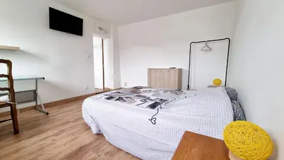 Un ou plusieurs lits dans un hébergement de l'établissement Le petit Château Avesnois - Studio pour 2 personnes - Cuisine Partagée