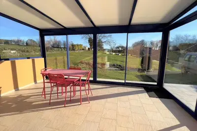 Balcon ou terrasse dans l'établissement Maison avec véranda - Gîte de l'Arbrisseau