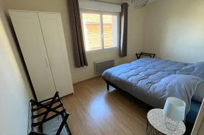 Un ou plusieurs lits dans un hébergement de l'établissement Maison avec véranda - Gîte de l'Arbrisseau