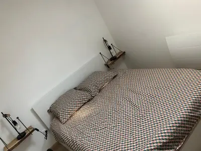 Un ou plusieurs lits dans un hébergement de l'établissement Une maison agréable pour se détendre