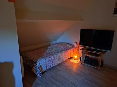 Un ou plusieurs lits dans un hébergement de l'établissement Chambre d'hôtes Bien-être