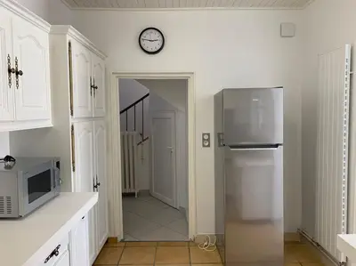 Cuisine ou kitchenette dans l'établissement Maison de 1 a 8 personnes entièrement rénovée