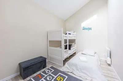 Un ou plusieurs lits dans un hébergement de l'établissement La Maisonnette 20 minutes de Disney