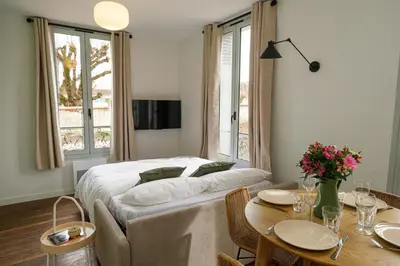 Un ou plusieurs lits dans un hébergement de l'établissement Villa Forestière Appart Le Ginkgo