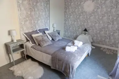 Un ou plusieurs lits dans un hébergement de l'établissement Appartement Un moment d’ÉVAsion
