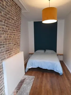 Un ou plusieurs lits dans un hébergement de l'établissement Appartement Atypique
