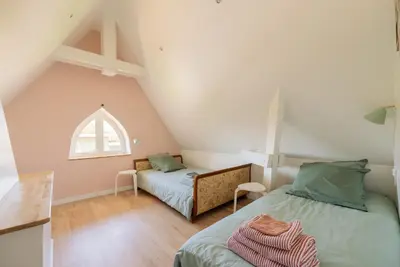 Un ou plusieurs lits dans un hébergement de l'établissement Villa Lenoir