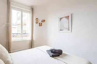 Un ou plusieurs lits dans un hébergement de l'établissement Immeuble spacieux - hyper centre - 15 couchages