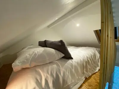 Un ou plusieurs lits dans un hébergement de l'établissement Tiny House Sedan