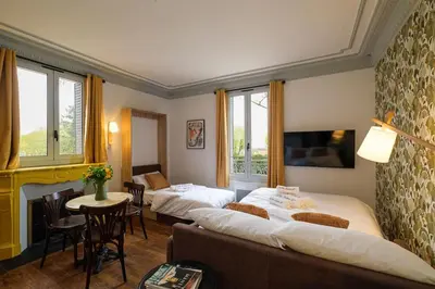 Un ou plusieurs lits dans un hébergement de l'établissement Villa Forestière Studio Le Sophora