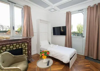 Télévision ou salle de divertissement dans l'établissement Villa Forestière Studio Le Chêne