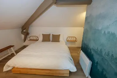 Un ou plusieurs lits dans un hébergement de l'établissement Villa Forestière Appart Le Cèdre